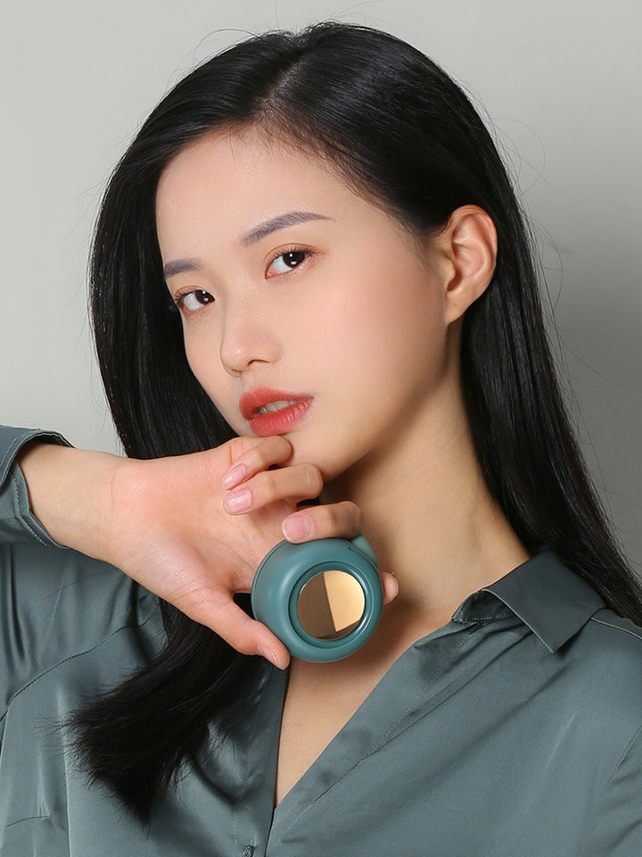 User wearing a personal cooling fan while commuting on a sunny day